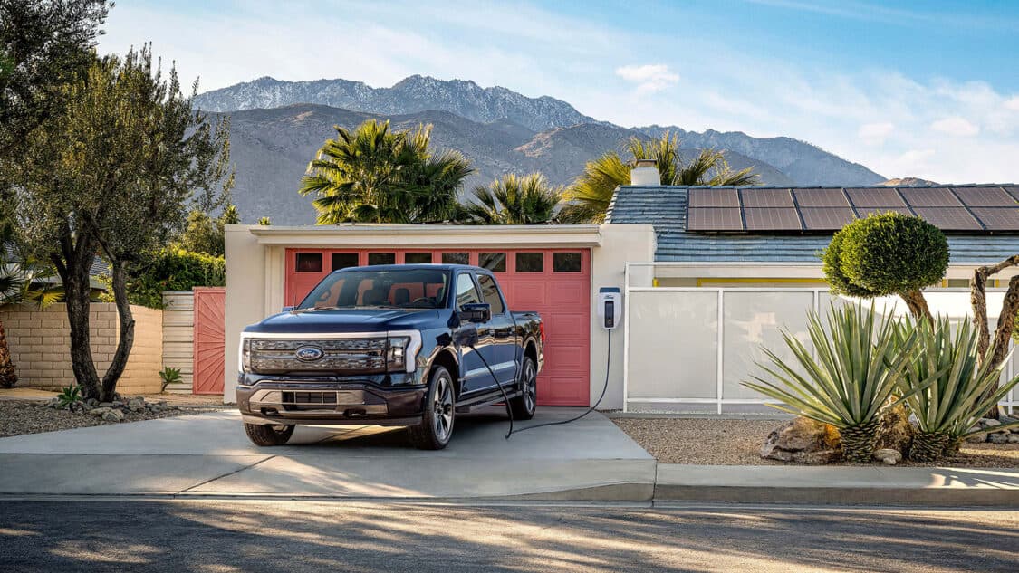 Ford F150 parked charging at desert home