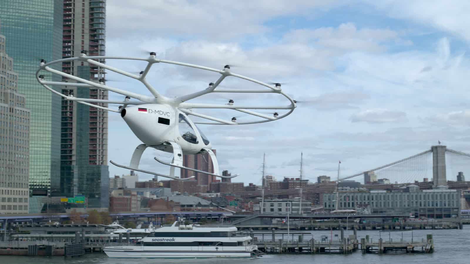 Volocopter flying over water and near buildings in NYC