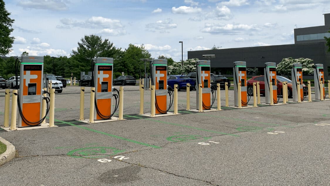 Image showcasing row of ChargePoint CPE250 EV chargers in parking lot