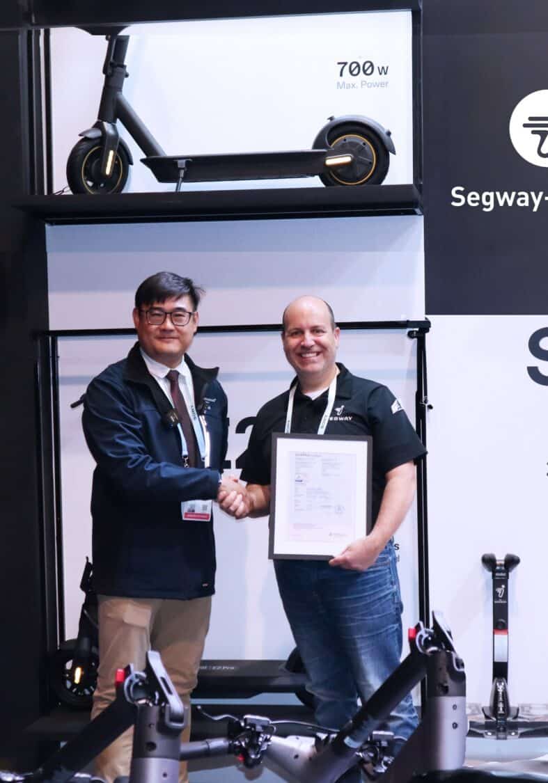 Image showcasing Jay Yang, Vice President of TÜV Rheinland Greater China Electrical, and Tom Hebert, VP of Sales, Segway Inc - Segway-Ninebot eKickScooters Earn Dual Certification