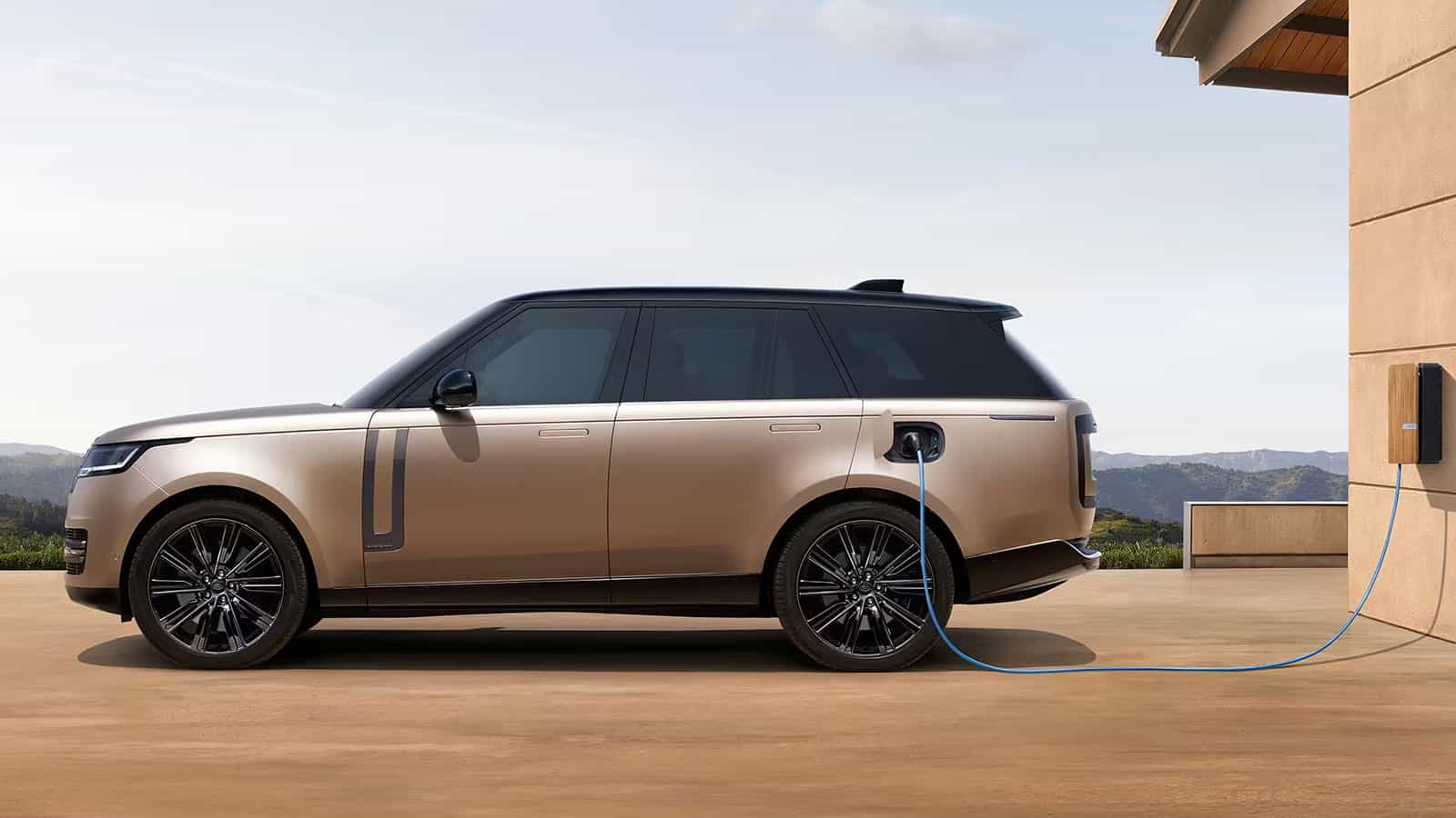 Range Rover Electric side view while charging