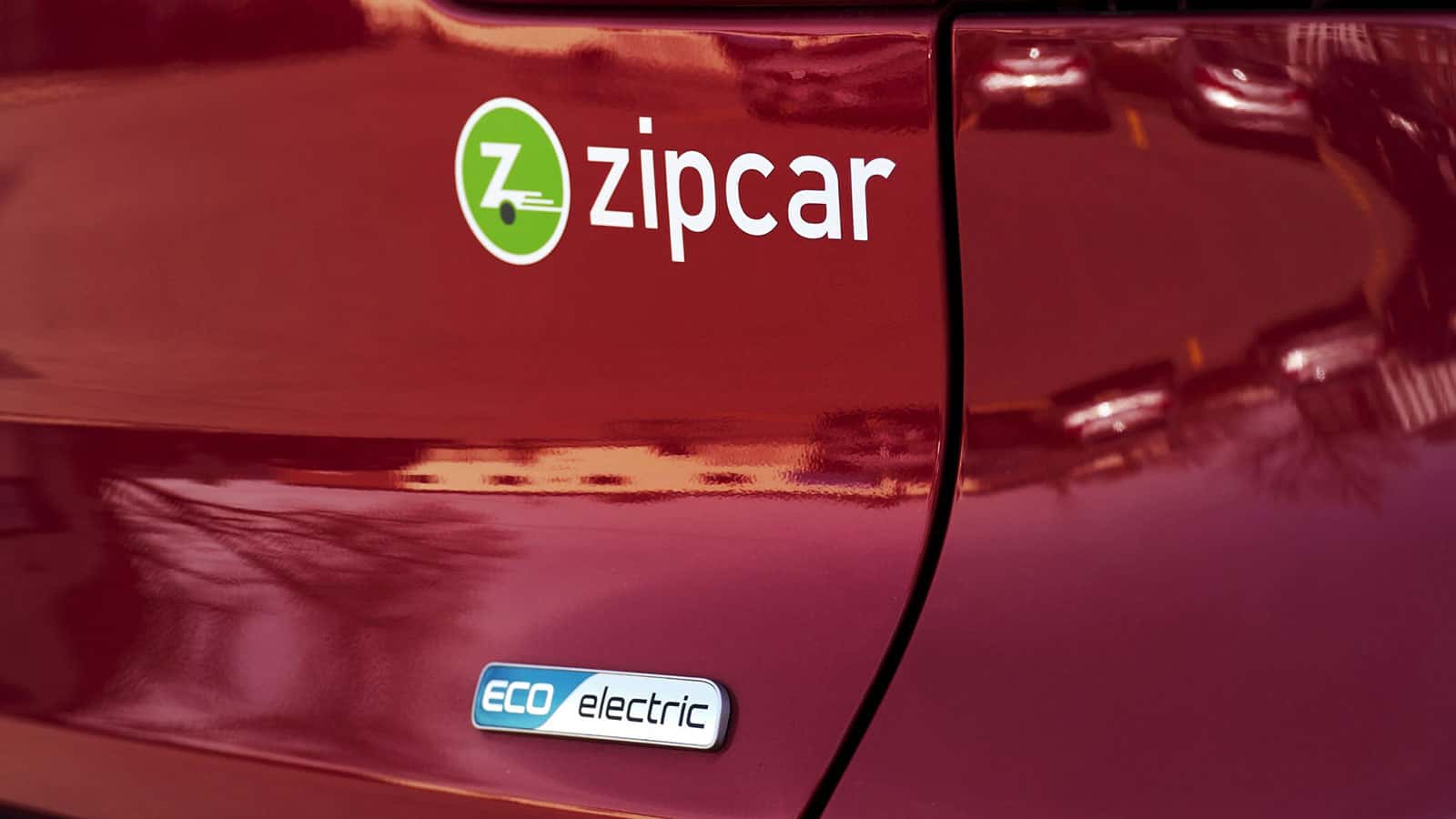 Zipcar logo close up on EV, national initiative