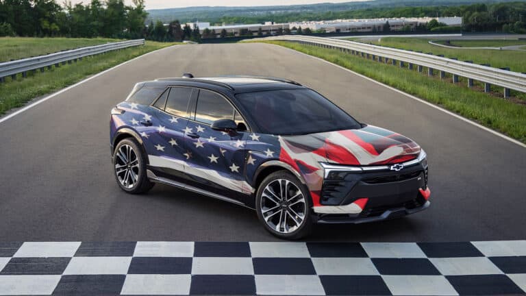 Chevrolet Blazer EV with american flag wrap, on a race track (politics).