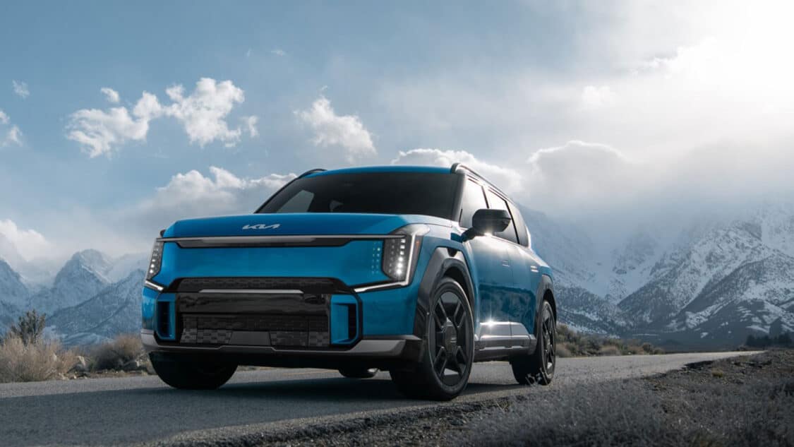 Kia EV sales up thanks to EV9 low front view with mountains in the background.