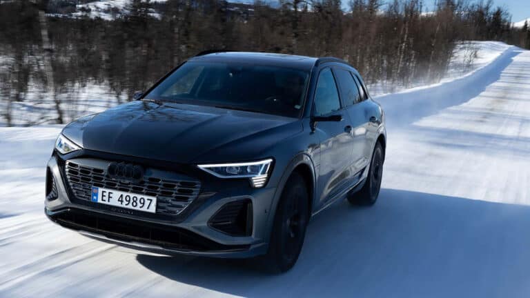 Audi e-Tron EV driving on snowy road in Norway