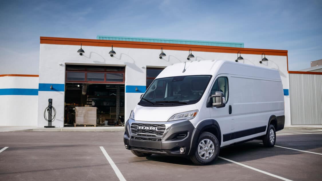 Ram Promaster EV front side view parked in front of shop