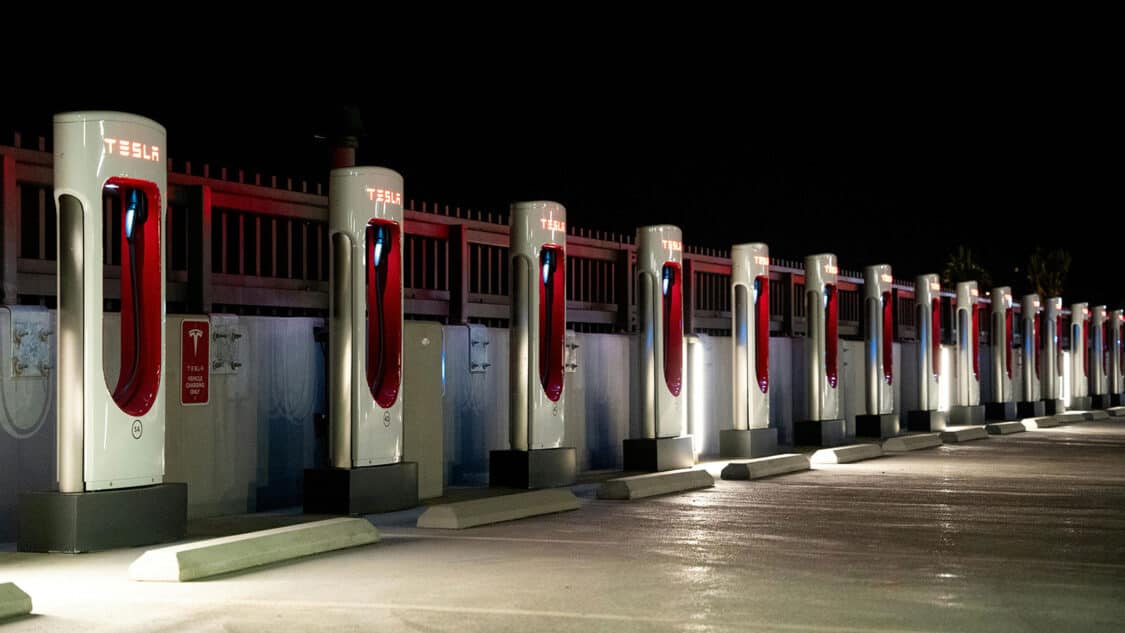 many open Level 3 EV Chargers from Tesla at night