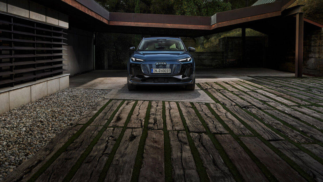 audi q6 e-tron front view parked on wooden driveway