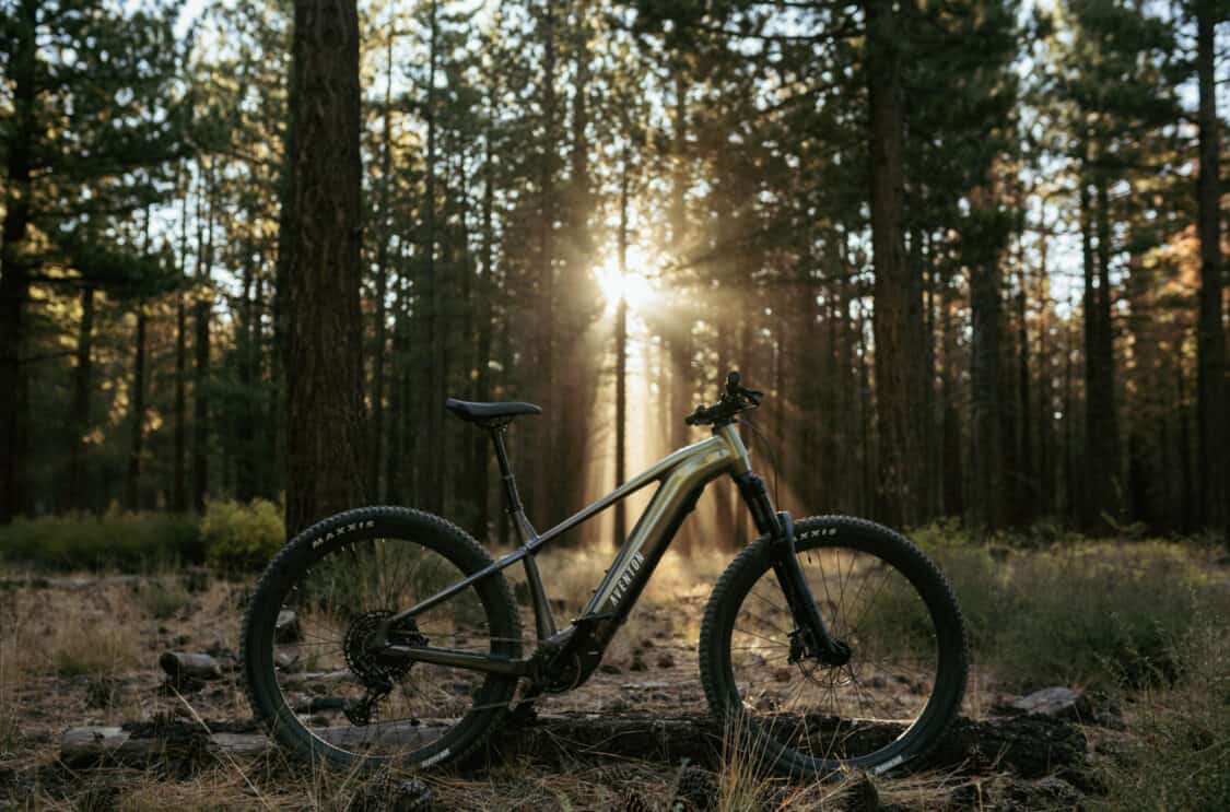 Aventon Ramblas electric mountain bike with a mid-drive motor, featuring a sleek olive green and black 