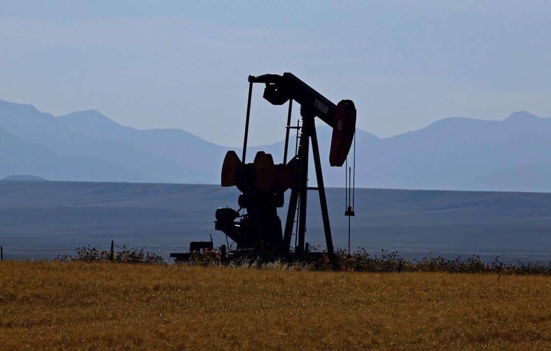 Big oil pump with mountains in the background