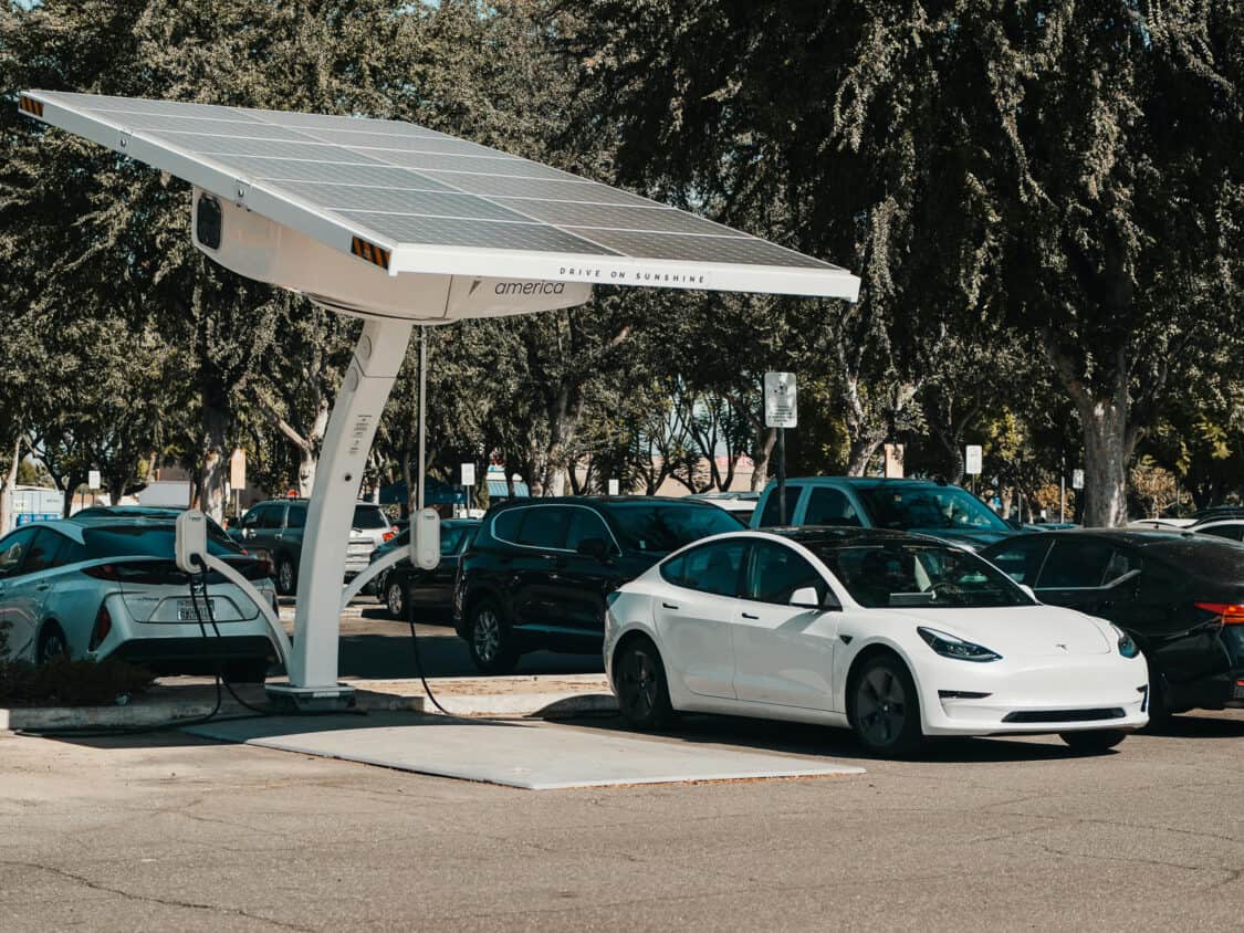 Toyota Prius and Tesla Model 3 electric cars charging with solar EV charging - photo by Kindel Media
