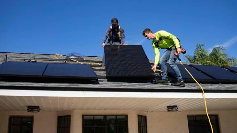 installing solar panels on rooftop for home and EV charging