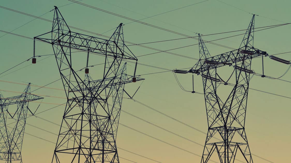 U.S. power grid transmission tower silhouettes