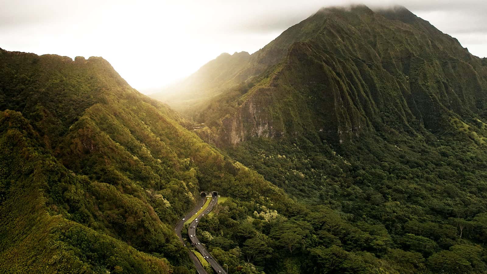 Oahu Hawaii mountain range and highway with electric cars