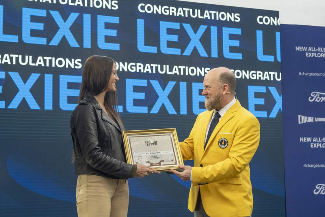 Nice, France: Lexie Alford receives official recognition from Record Setter for being the first person to circumnavigate the globe in an electric vehicle, using the new electric Ford Explorer SUV