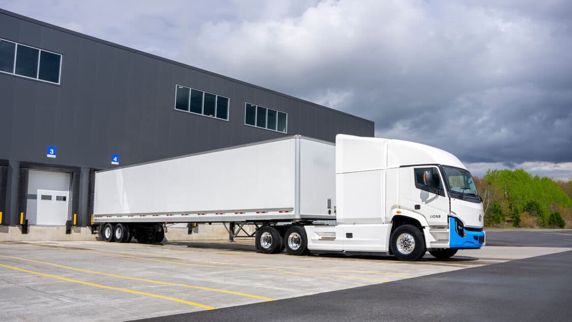 Lion 8 commercial electric truck, backing up to warehouse dock door