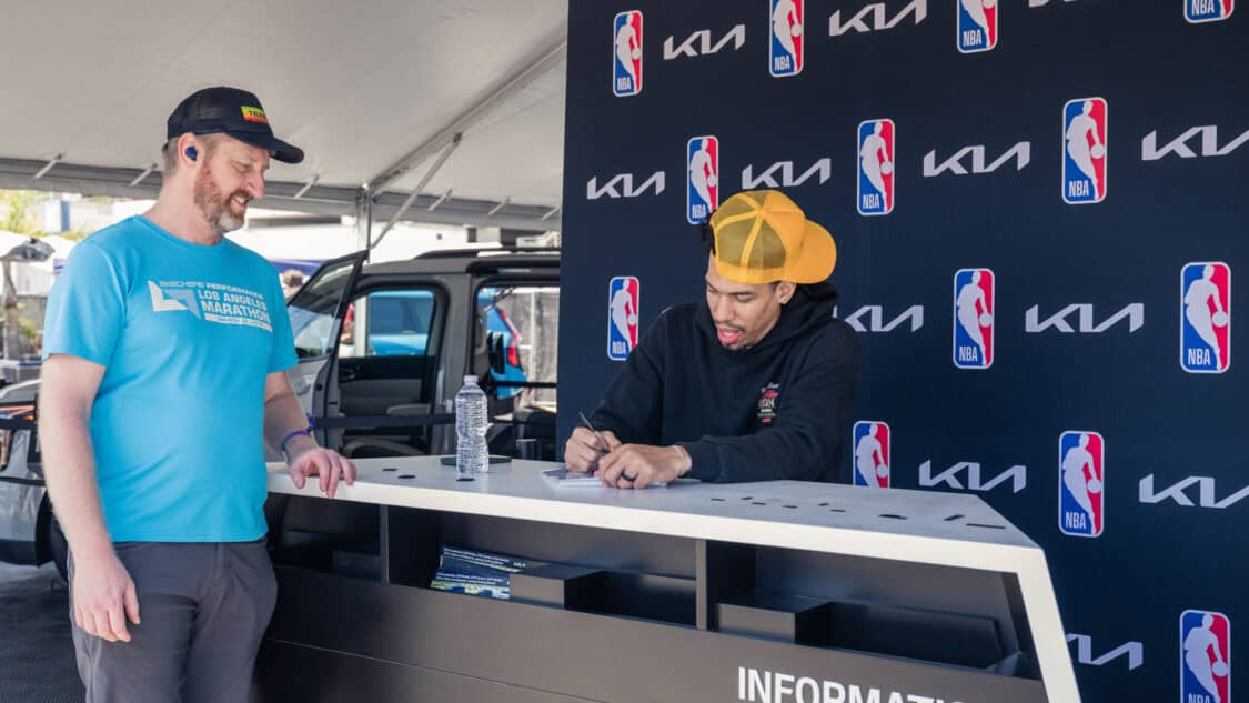 Danny Green NBA Champion signing autographs at the Kia Booth at Electrify Expo in Long Beach.