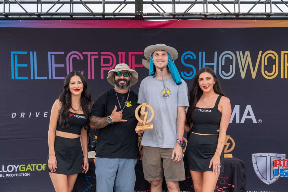 Caleb Lower with JackRabbit representative and Yokohoma Tires brand ambassadors accepting award for Best Scooter / Micro Bike at Electrify Showoff in Denver