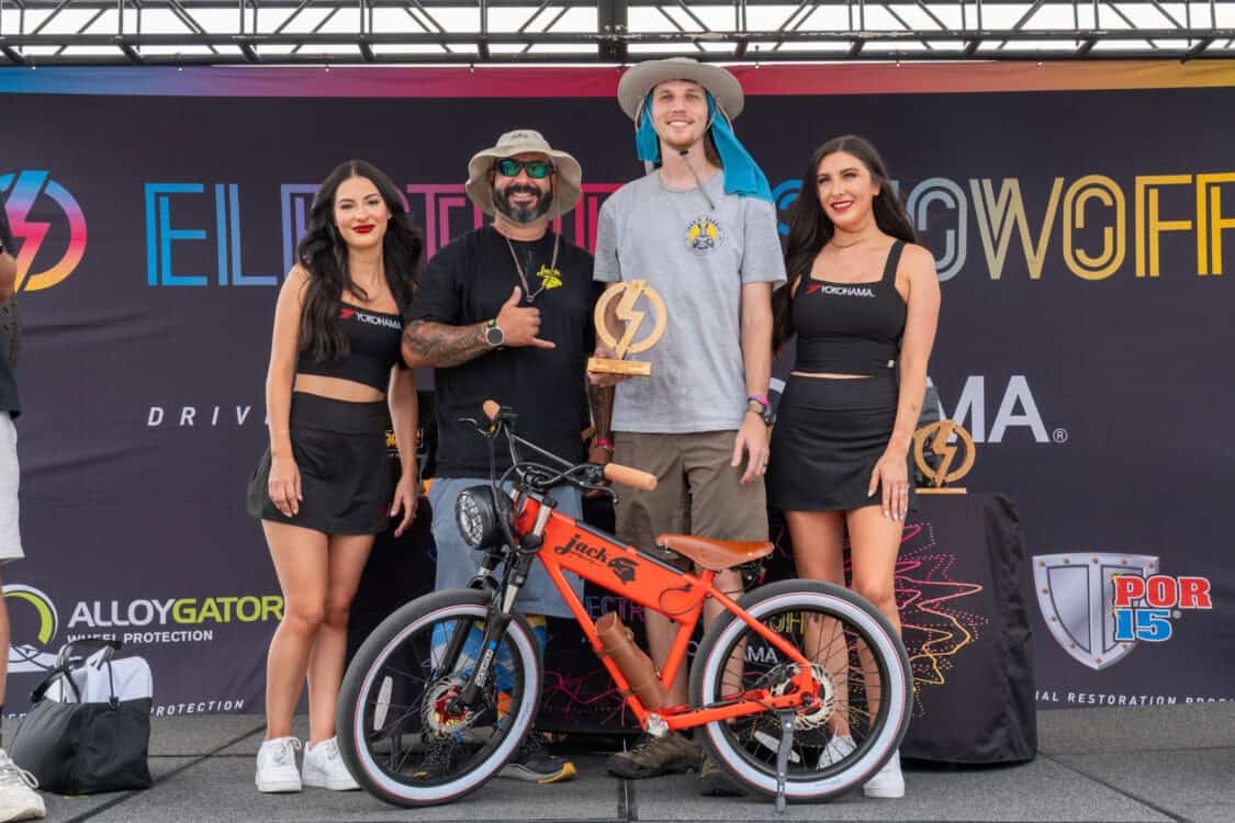 Caleb Lower with JackRabbit representative and Yokohoma Tires brand ambassadors accepting award for Best Scooter / Micro Bike at Electrify Showoff in Denver