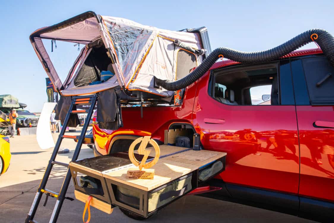 Sarah and Matthew Buecher's 2022 Rivian R1T Launch Edition at Electrify Showoff Outdoor Rec in San Francisco - custom kitchen and tent