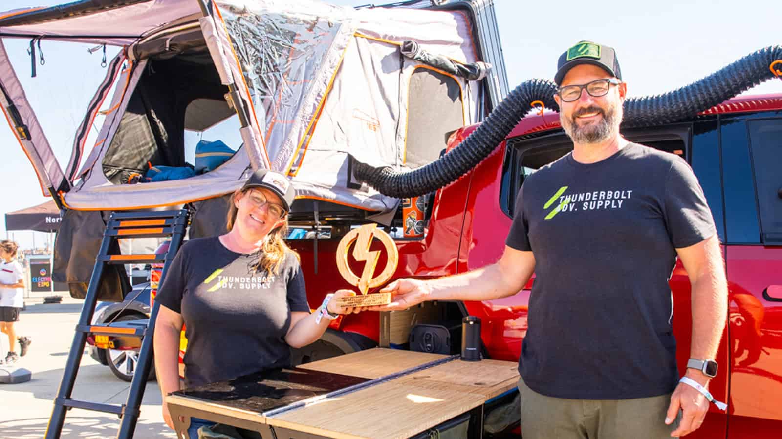 Sarah and Matthew Buecher's 2022 Rivian R1T Launch Edition at Electrify Showoff Outdoor Rec in San Francisco - custom kitchen and tent