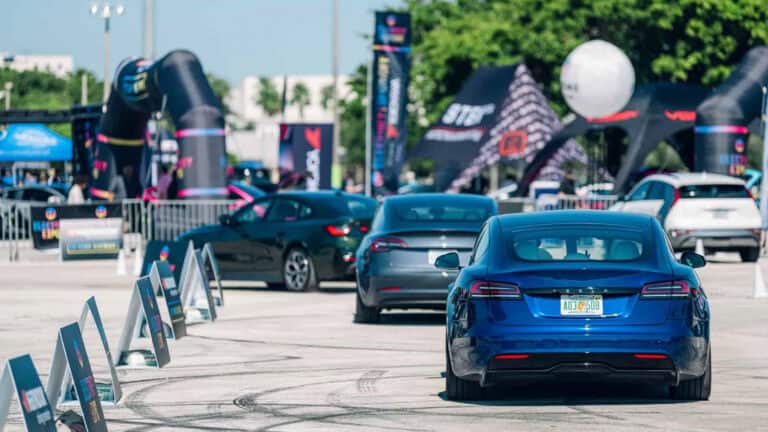 Tesla, BMW, Hyundai, and Kia electric vehicles lined up for test drives at Electrify Expo.