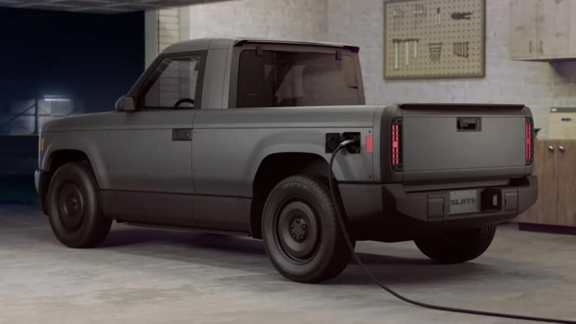 Slate Auto EV Truck in garage with Tesla NACS charger plugged in