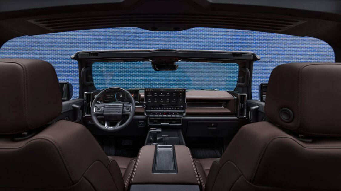 Front-facing view of the interior of the 2026 GMC Hummer EV SUV with the Infinity Roof Panels removed. Stealth Eclipse Interior color shown.