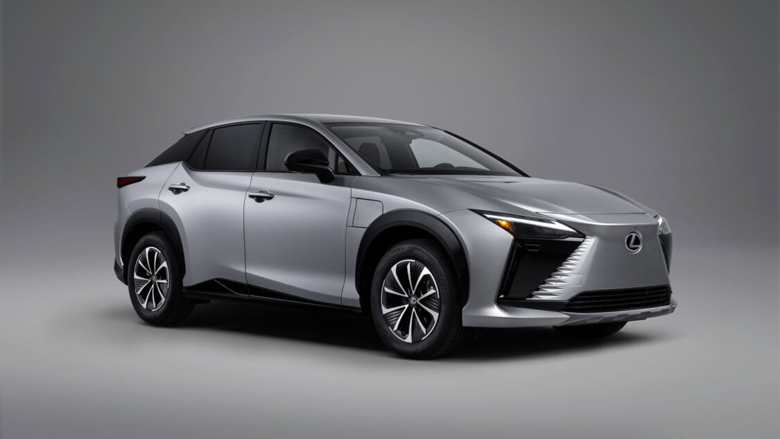 Front three-quarter view of a 2026 Lexus RZ 350e electric SUV in Wind color, light gray with subtle metallics.