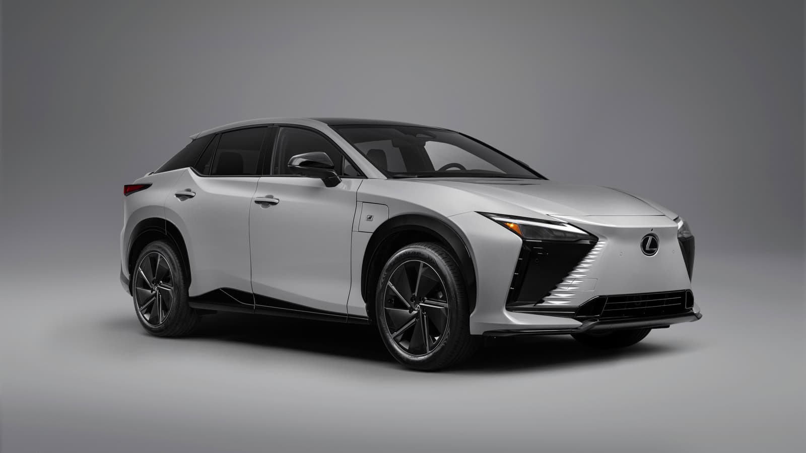 Front three-quarter passenger view of a 2026 Lexus RZ 550e F SPORT electric SUV.