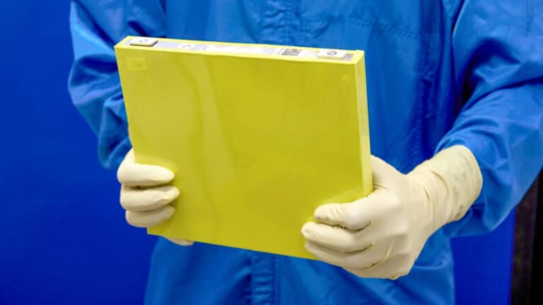 An employee holds a full-size prototype LMR battery cell at the General Motors Wallace Battery Cell Innovation Center. GM has prototyped approximately 300 full-size LMR cells as it worked with LG Energy Solution to crack the code on the chemistry. (Photo by Steve Fecht for General Motors)