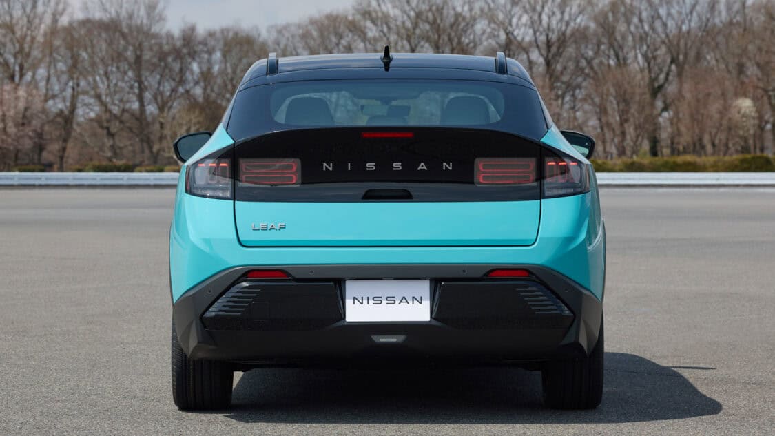 2026 Nissan Leaf compact electric SUV in Seabreeze Blue, showcasing its new crossover design and updated LED taillights.