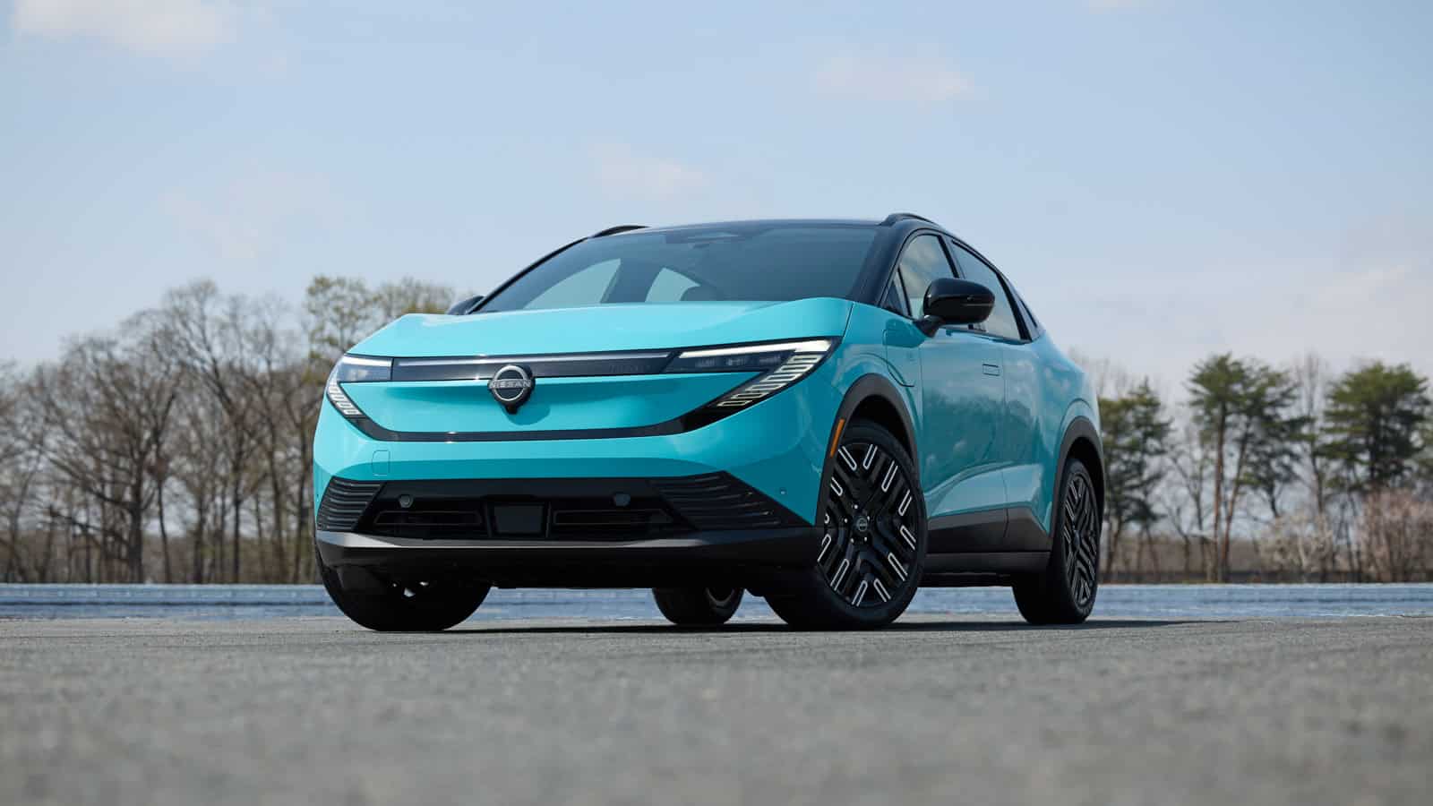 2026 Nissan Leaf compact electric SUV in Seabreeze Blue, showcasing its new crossover design and updated LED headlights.