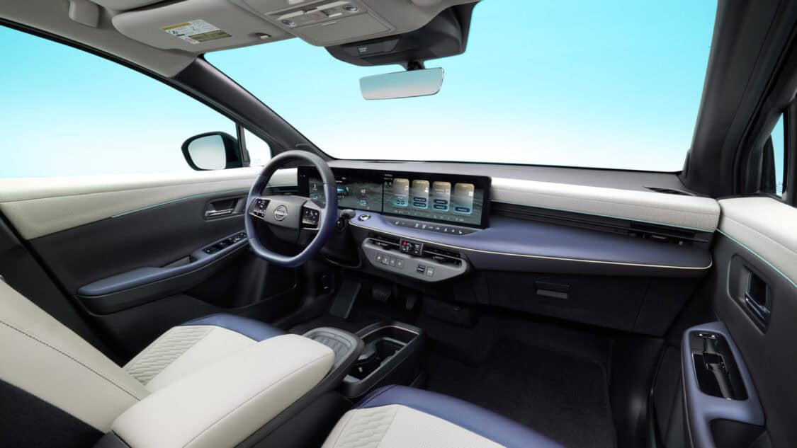 2026 Nissan Leaf dashboard with dual 14.3-inch displays, showing Google built-in apps, EV charge data, and climate controls.