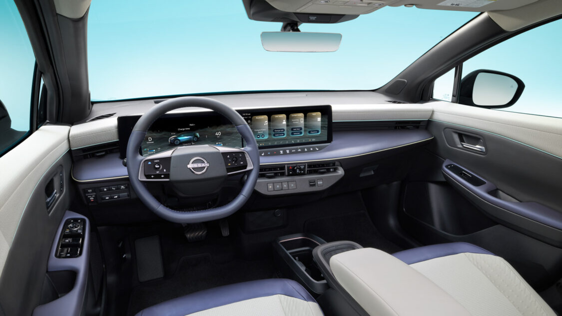 2026 Nissan Leaf dashboard with dual 14.3-inch displays, showing Google built-in apps, EV charge data, and climate controls.