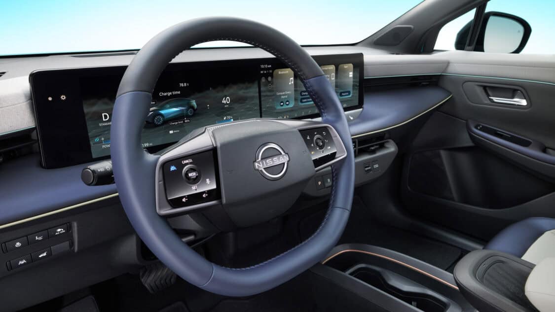 2026 Nissan Leaf dashboard with dual 14.3-inch displays, showing Google built-in apps, EV charge data, and climate controls.