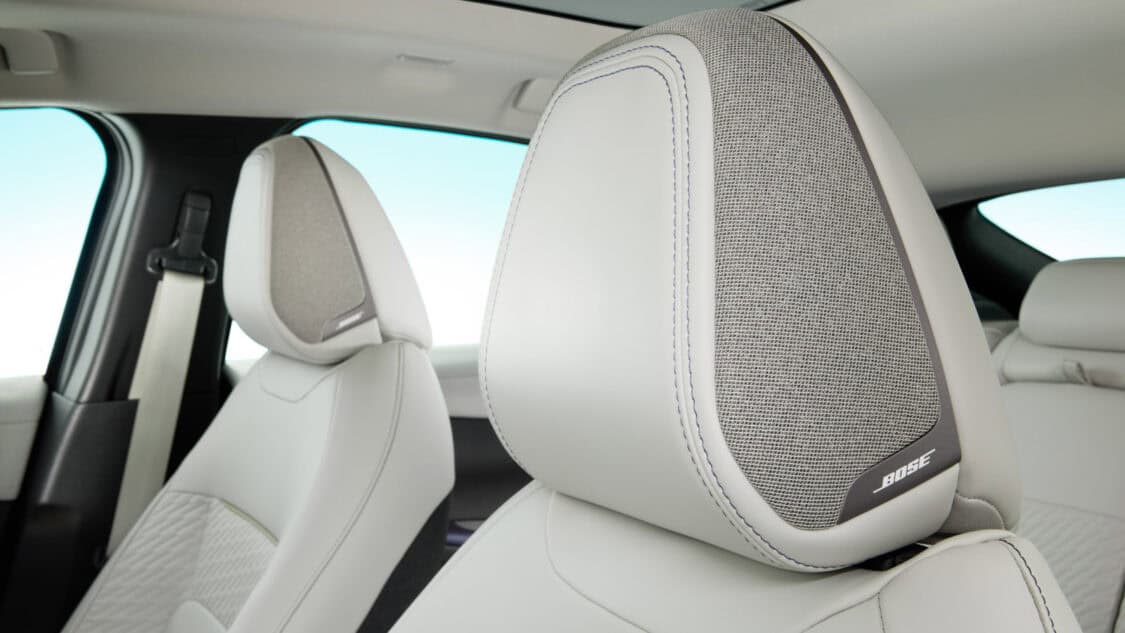 Close-up of the 2026 Nissan Leaf’s front seat headrest with integrated Bose Personal Plus speaker, part of the premium audio system.