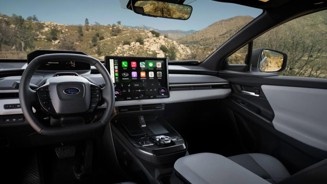 Interior of the 2026 Subaru Trailseeker featuring a 14-inch touchscreen with Apple CarPlay, wireless charging, and a wide center console.