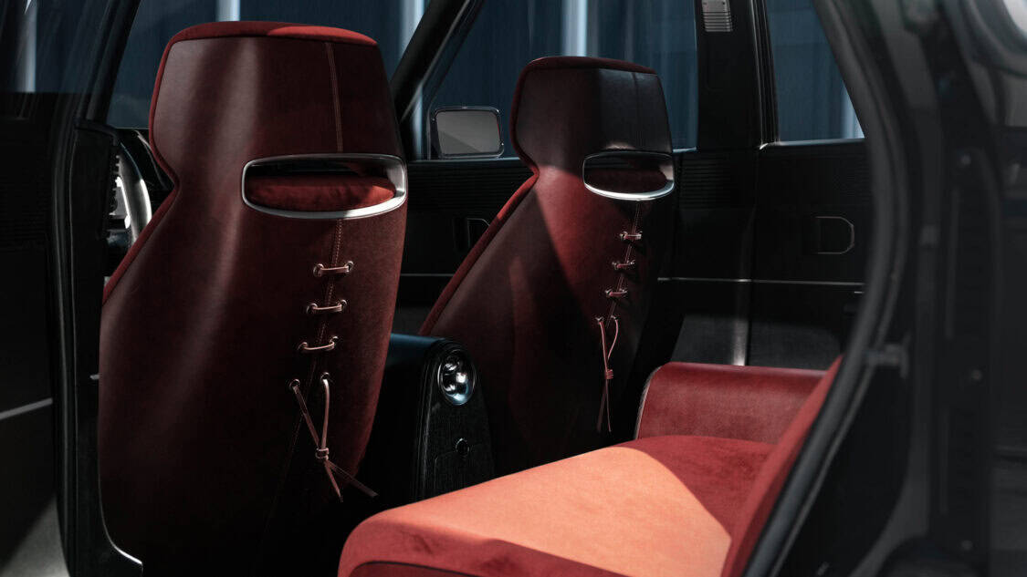 Rear cabin view of the Hyundai Grandeur Heritage Series concept, featuring burgundy velvet seating and Napa leather seatbacks with elegant lace-up detailing.