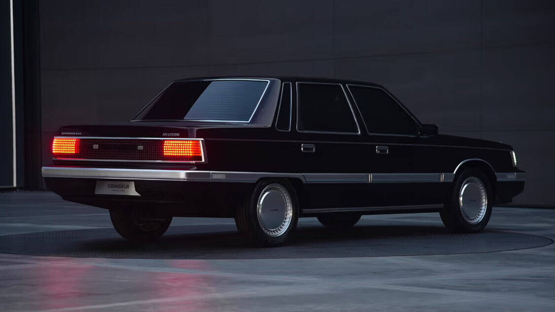 Hyundai Grandeur Heritage Series electric concept car featuring retro 1980s sedan styling with pixel LED taillights and covered wheels.