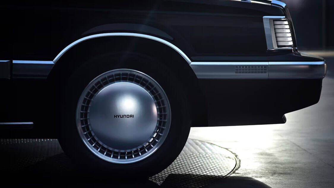 Hyundai Grandeur Heritage Series electric concept car featuring retro 1980s sedan styling with pixel LED headlights and covered wheels.