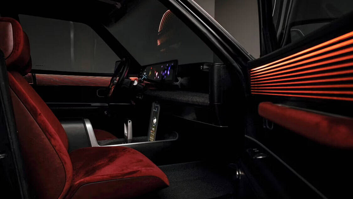 Interior of the Hyundai Grandeur Heritage Series concept car featuring burgundy velvet seats, ambient bronze lighting, and dual digital displays.