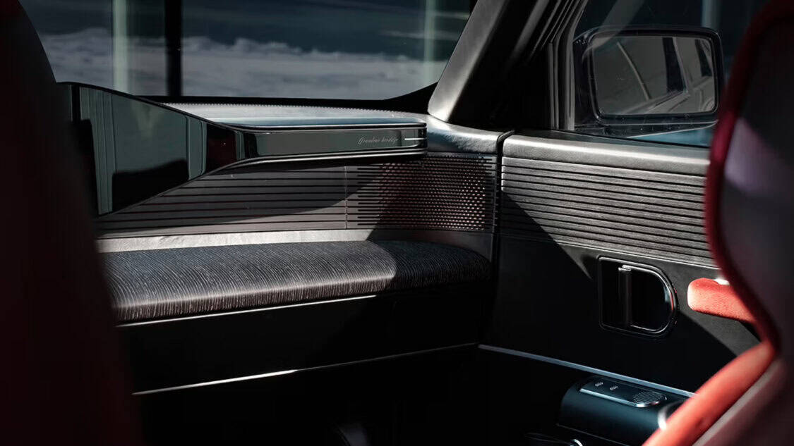 Interior of the Hyundai Grandeur Heritage Series concept car featuring burgundy velvet seats, ambient bronze lighting, and dual digital displays.
