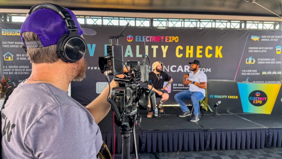 Blake Aaron at Electrify Expo, the co-host of the EV Reality Check Stage, powered by GreenCars, filmed for media coverage on electrification and EV technology