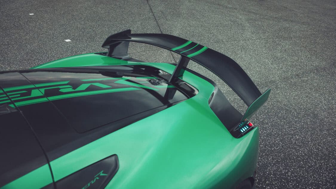 Close-up of the Rimac Nevera R’s fixed rear wing, designed to boost downforce by 15% and stabilize the car during extreme high-speed runs.