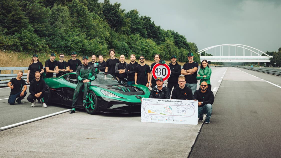 Rimac team celebrates with the Nevera R and a record board after achieving a 0–400–0 km/h time of 25.79 seconds at ATP Papenburg.