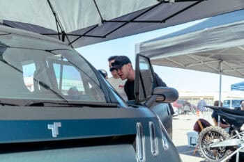 Attendees lean in to check out the TELO MT1 electric mini truck on display at Electrify Expo San Francisco.