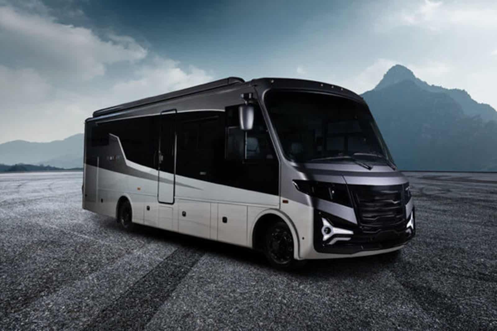 A black and silver Entegra Coach Embark, the world’s first range-extended electric Class A motorhome by THOR Industries, parked against a mountain backdrop.
