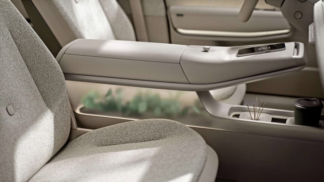 Interior of the Volkswagen ID. CROSS Concept featuring Vanilla Chai lounge design, digital displays, and floating center console with plants.