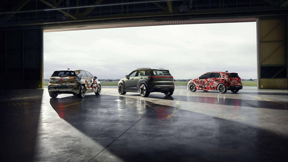 Volkswagen ID. Polo, ID. CROSS Concept, and ID. Polo GT prototypes parked together at an airfield hangar.